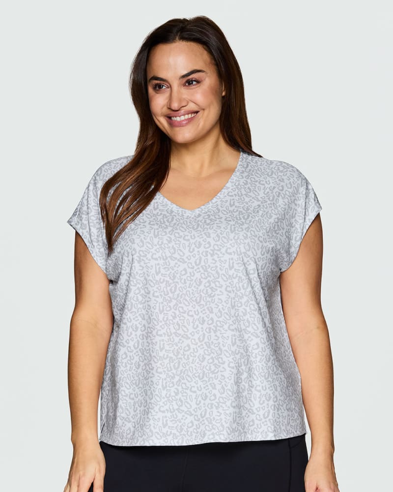 Front of a model wearing a size 1X Super Soft Leopard Tee in Light Grey by RBX Active. | dia_product_style_image_id:244638